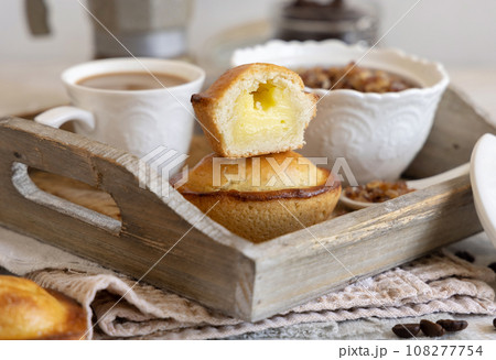 Pasticciotto leccese pastry filled with egg custard cream on a tray close up Pasticciotto leccese pastry filled with egg custard cream on a tray close up 108277754