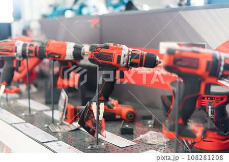 Tool for work, repair and construction in store. Wired power tools and battery powered equipment Tool for work, repair and construction in store. Wired power tools and battery powered equipment 108281208
