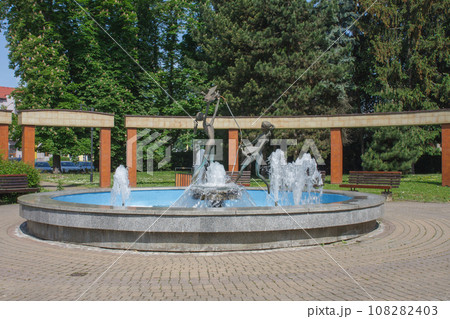 Park in city Zilina, water fountain zilina virgins in spring day, Slovakia. Park in city Zilina, water fountain zilina virgins in spring day, Slovakia. 108282403