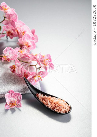 Beautiful blooming orchid flowers and pink sea salt. 108282630