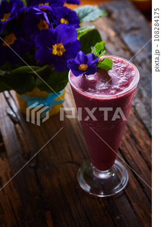 Delicious berry smoothie on table Delicious berry smoothie on table 108284175