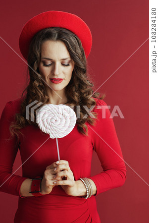 woman in dress and beret isolated on background woman in dress and beret isolated on background 108284180