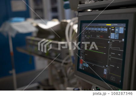 Turned on vital signs monitor in an empty operating room at a veterinary clinic. Empty operating room ready for work. The concept of preparing a veterinary operating room. 108287346