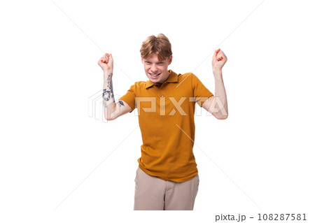 young inspired genius caucasian male student with red hair dressed in yellow t-shirt young inspired genius caucasian male student with red hair dressed in yellow t-shirt 108287581