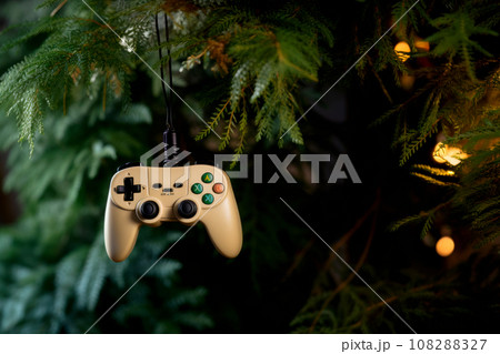 A close up view of a Christmas fir tree frond or a green pine tree branch with joystick toy like Christmas Tree balls A close up view of a Christmas fir tree frond or a green pine tree branch with joystick toy like Christmas Tree balls 108288327