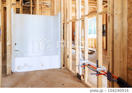 Plumbing work bathroom remodel installing new acrylic bathtub in new house Plumbing work bathroom remodel installing new acrylic bathtub in new house 108290916