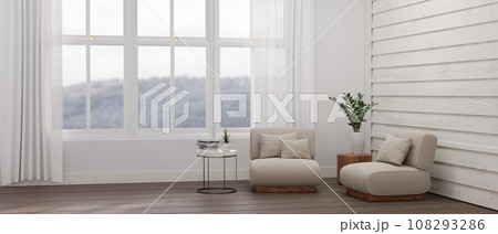 Interior design of a minimal, farmhouse living room with a comfortable chairs and a wood plank wall. 108293286