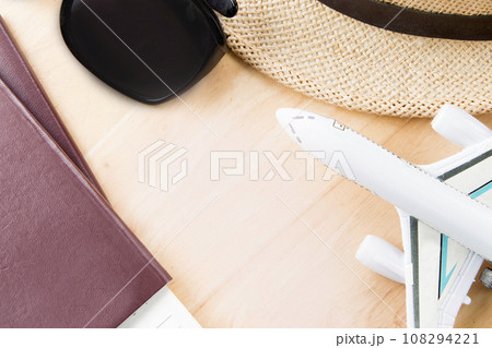 Travel accessories costumes.Passport, glasses, on a wooden. 108294221