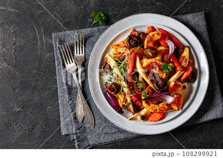 baked winter veggies and mushrooms on a plate baked winter veggies and mushrooms on a plate 108299921