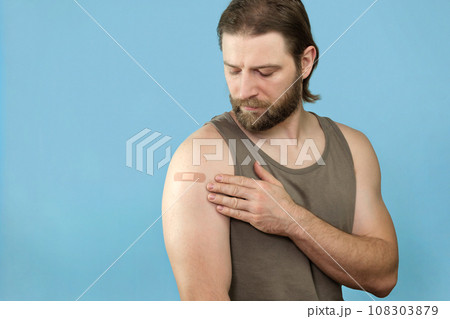 Successful Covid-19 Vaccination. Vaccinated Man Gesturing Okay And Showing Arm With Adhesive Bandage After Vaccine Injection, Posing Wearing Antiviral Protective Face Mask, blue Background, Collage 108303879