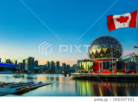 Canadian flag in front of view in Vancouver Downtown,British Columbia, Canada 108307101