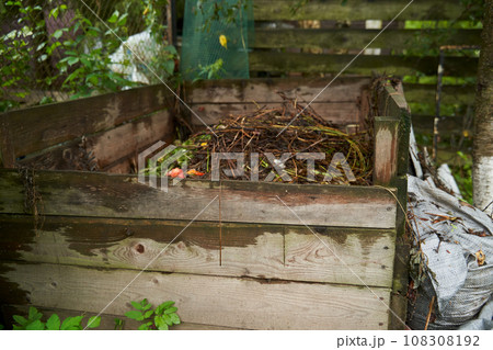 Compost bin in the garden. Food biodegradable waste is composting and recycling in organic fertilizer for soil. 108308192