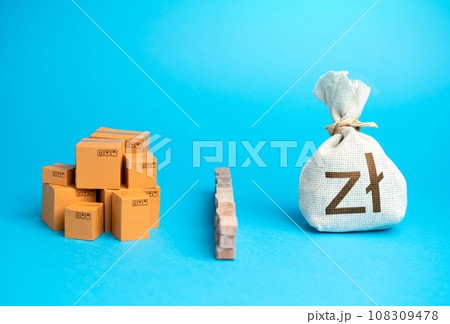 Boxes with goods and polish zloty money bag are separated by a barrier. Protection of the domestic market from import of price dumping goods.  108309478