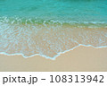 Soft wave of blue ocean on sandy beach. Summer vacation in island. clear azure water Background. 108313942