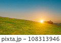beautiful grass field with sunset or sunrise sky. Countryside landscape view background. 108313946