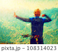 Boy sit on mtb and makes gesture down to Lago di Garda valley 108314023
