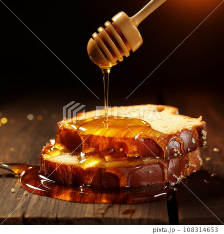 Pouring fresh honey on bread slices 108314653