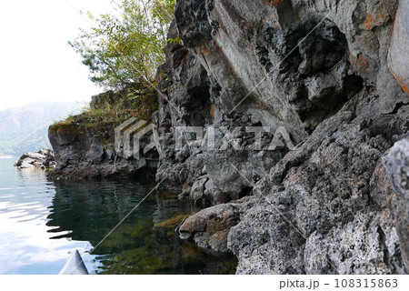 Kayak and canoe at Lake Saiko near Mt. Fuji. The calm water surface is calm and pleasant. 108315863