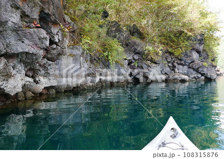 Kayak and canoe at Lake Saiko near Mt. Fuji. The calm water surface is calm and pleasant. Kayak and canoe at Lake Saiko near Mt. Fuji. The calm water surface is calm and pleasant. 108315876