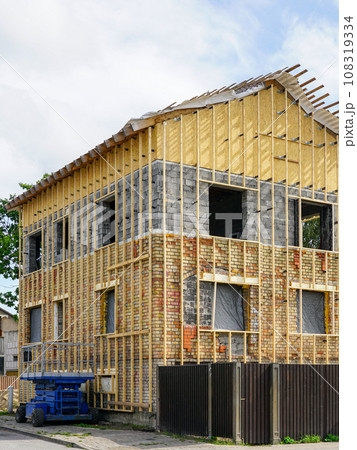 The facade of an residential house with wooden laths before applying the thermal insulation layer 108319334