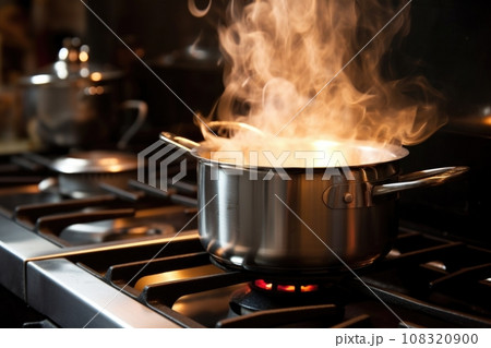 a close-up of a bubbling pot on a stove 108320900