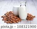 almonds next to a carton of almond milk 108321900