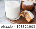 almond milk with a cookie dipped in 108321903