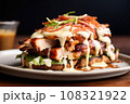 alabama chicken inside an open sandwich, drizzled with white bbq sauce 108321922