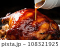 close-up of white bbq sauce glazing over a cooked alabama chicken 108321925