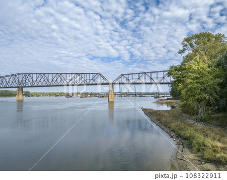 Chain of Rocks on the Mississippi River above St Louis the old historic bridge and the new bridge with construction work Chain of Rocks on the Mississippi River above St Louis the old historic bridge and the new bridge with construction work 108322911