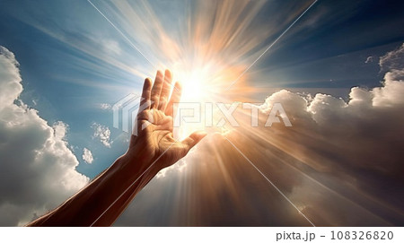 A man's hand reaches for the light in the clouds 108326820