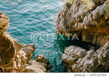 Clear blue sea at the rocks. Top view Clear blue sea at the rocks. Top view 108328768