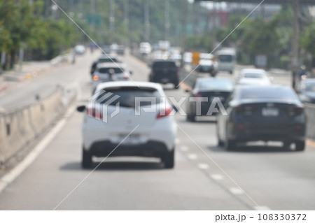 highway traffic with safety barrier on road asphalt, blurred image 108330372