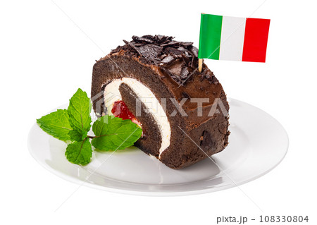 Slice of delicious homemade chocolate roll cake with Italian flag cocktail pick. 108330804