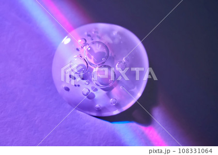 A drop of serum under ultraviolet light. 108331064