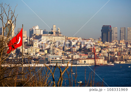 Turkish flag and Istanbul cityscape across Bosphorus Turkish flag and Istanbul cityscape across Bosphorus 108331969