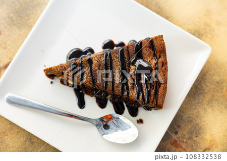 Piece of brawny with walnuts served in a plate 108332538