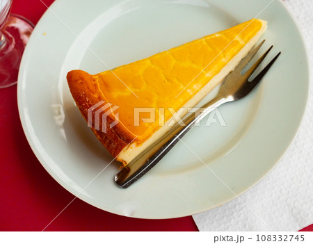 Piece of glazed cheesecake served in a plate Piece of glazed cheesecake served in a plate 108332745