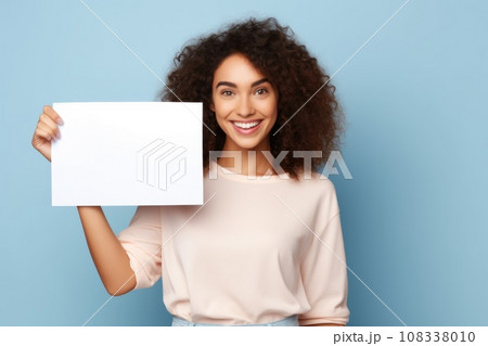 smiling woman holding a blank placard sign poster paper in his hands 108338010
