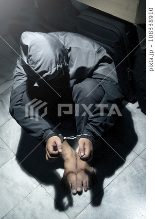 The man with tied hands in handcuffs 108338910