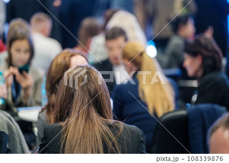 Back view of businesswomen attending conference at export forum Back view of businesswomen attending conference at export forum 108339876