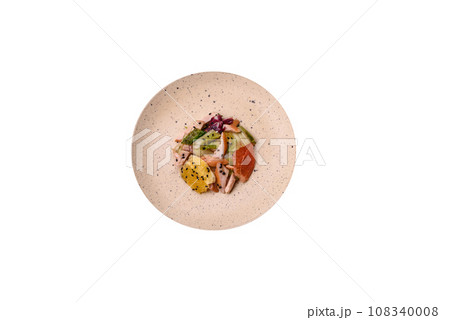 Delicious fresh juicy salad of sliced chicken, grapefruit, lettuce, sesame with olive oil Delicious fresh juicy salad of sliced chicken, grapefruit, lettuce, sesame with olive oil 108340008