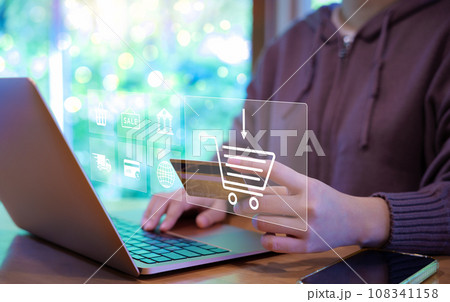 Woman use laptop to shop online with shopping cart and business icons. Purchase order, Digital marketing concept, Retail market on the Internet website, Use credit card to payment, E-Commerce, Sale, Woman use laptop to shop online with shopping cart and business icons. Purchase order, Digital marketing concept, Retail market on the Internet website, Use credit card to payment, E-Commerce, Sale, 108341158