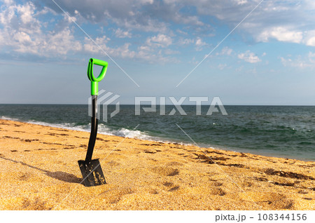 Car shovel for SUVs in the sand on the seashore. Terraforming a sandy beach. Coastal change 108344156