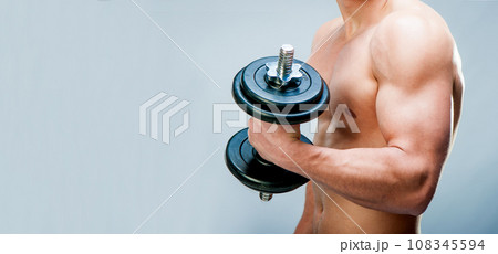 muscular man on gray background muscular man on gray background 108345594