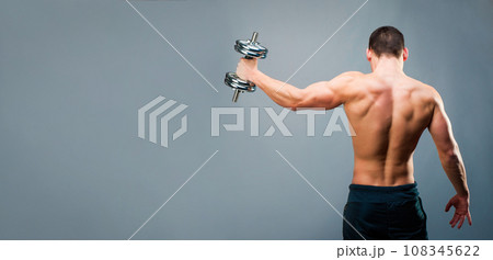 muscular man on gray background 108345622