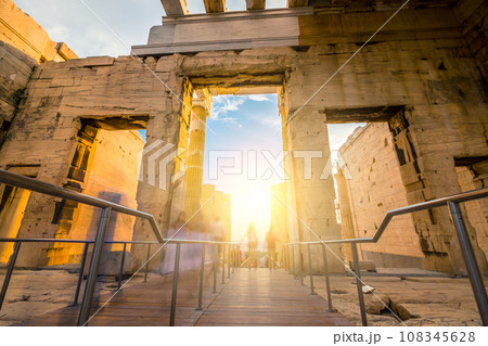 Tourists pass through the Propylaea entrance to the Parthenon, motion blur Tourists pass through the Propylaea entrance to the Parthenon, motion blur 108345628