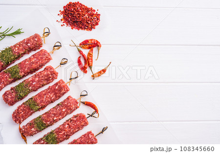 Raw kebab with spices 108345660