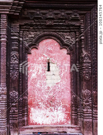 Wall with details of traditional Nepalese temple Wall with details of traditional Nepalese temple 108345764