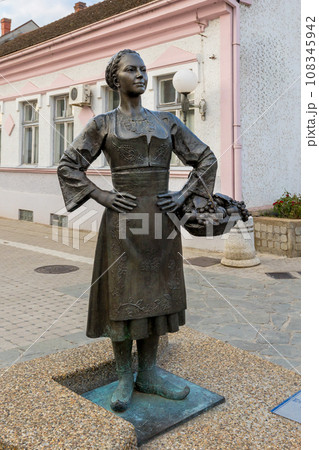 Grocka, Serbia woman statue in the center of town 108345942
